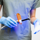 UV lamp in dentists hand in rubber gloves. - PhotoDune Item for Sale