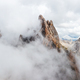 Dense fog descends into Seceda mountain on sunny day - PhotoDune Item for Sale