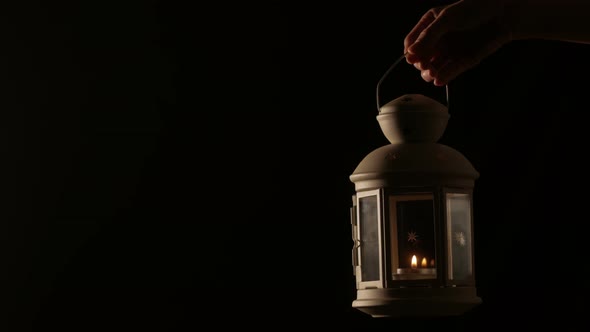 Woman Holding Christmas Lantern