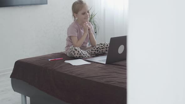 First Grader Girl Uses Laptop