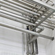 Complex network of industrial pipes along a white ceiling. - PhotoDune Item for Sale