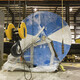 Industrial spool wrapped in blue at a warehouse ready for transport - PhotoDune Item for Sale
