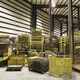 Industrial warehouse interior bustling with stacked materials and machinery. - PhotoDune Item for Sale