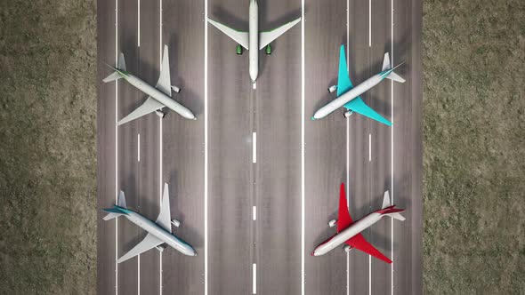 Aerial view of parked airplanes at the airport runway alt