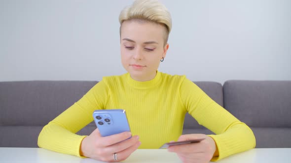 Customer buying online with credit card and mobile phone in 4k stock video alt