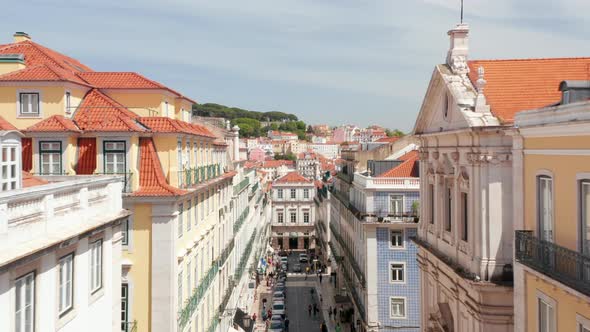 Drone Camera Flying Forwards Over Street in Level of Surrounding Buildings Top Floor alt