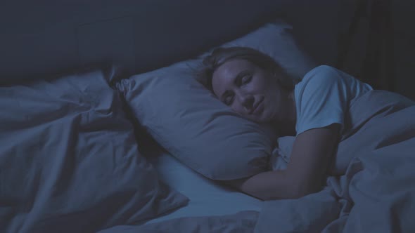 The Woman Sleeps in Her Bed alt