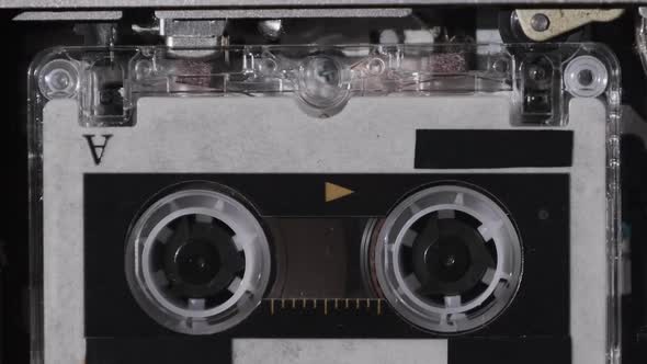 The Microcassette Spins in a Portable Handheld Recorder Tape Retro Player alt