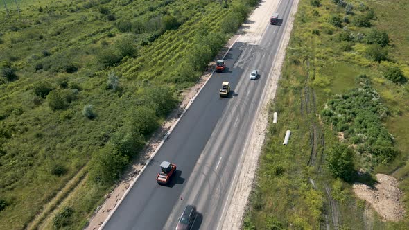 Aerial Top View of Roadworks with Road Workers Lay Asphalt alt