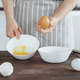 Woman Separating Egg Yolk and White for Dough - PhotoDune Item for Sale