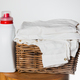 Laundry Detergent and Folded White Linen in a Basket - PhotoDune Item for Sale