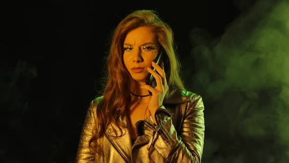 Portrait of Young Pretty Woman Is Emotionally Talks on His Smartphone, Gets Upset and Indignantly alt