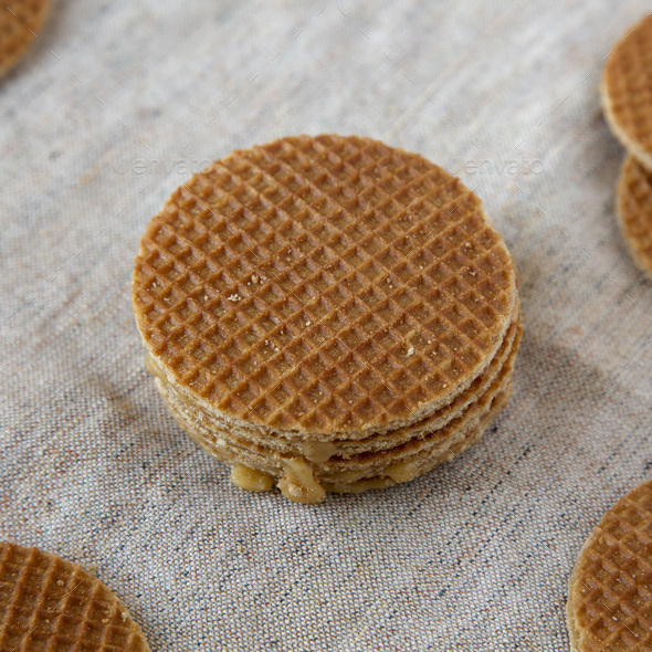 Homemade dutch stroopwafels with honey-caramel filling on cloth, low ...