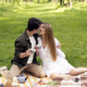 young couple on a picnic in summer park, drinking tea - PhotoDune Item for Sale