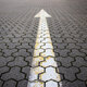 road markings, arrow on the road made of paving stones, indicating the direction forward, - PhotoDune Item for Sale