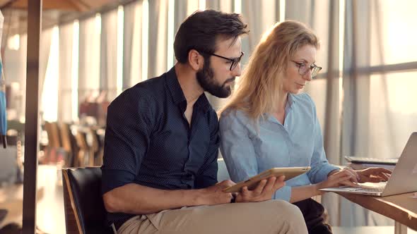 Attorney In Advocacy Company Analyzing Corporate Deal Contract Brief In Office.Two Notary In Office  alt