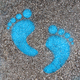 Blue footprint signs on an asphalt - PhotoDune Item for Sale
