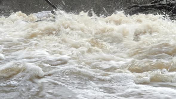 Closeup Shot of Water Splashing in a Fast Flowing River
