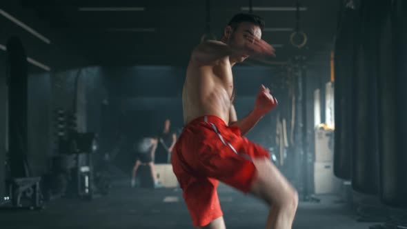 Aggressive Professional Fighter Training Shadow Boxing Throwing a Vicious Blow. A Young Champion Is alt