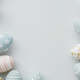 Artfully arranged Easter eggs on a dual-tone pastel background - PhotoDune Item for Sale