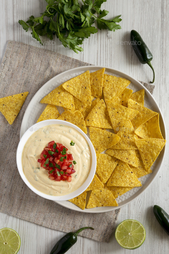 Top View, Homemade Cheesy Dip With Yellow Tortilla Chips Over White ...