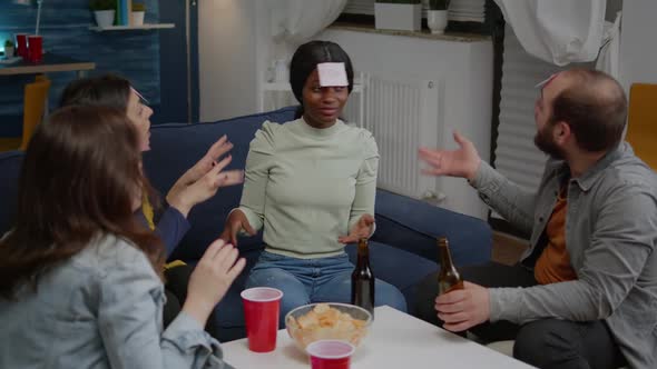 Group of Multiethnic Friends with Sticky Notes Putting on Forehead alt
