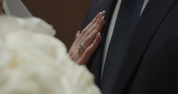 The Groom Touches The Gentle Hand Of The Bride