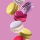 Colorful macaroons falling on pink background - PhotoDune Item for Sale