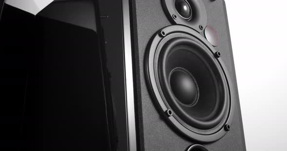 Music Speakers with Vibrating Bass Woofer Slowly Turning Around alt