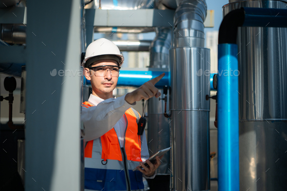 Engineers inspect the completed air conditioning and water systems to continue verifying - Stock Photo - Images