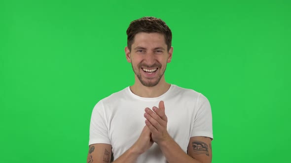 Portrait of Confident Guy Is Clapping His Hands with Wow Happy Joy and Delight alt