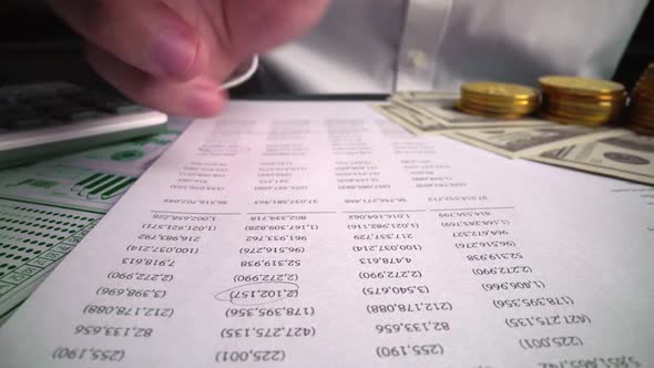 Accountant analyzing business marketing data on paper dashboard at office table. alt