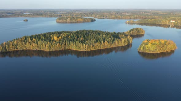 The Islands with the Trees in the Huge Lake Saimaa in Finland
