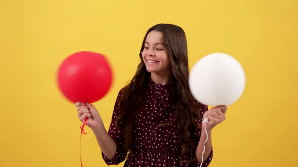 Happy Child Holding Party Balloons on Yellow Background Childhood alt