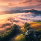Aerial view of meadows and mountains in low clouds at sunrise - PhotoDune Item for Sale
