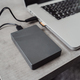 External hard disk drive connected to a modern laptop via USB - PhotoDune Item for Sale