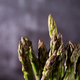 Fresh green asparagus on dark background - PhotoDune Item for Sale