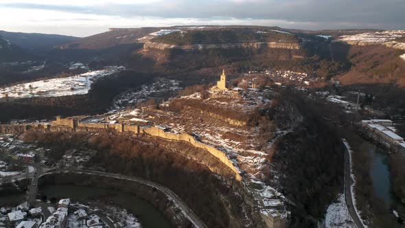 Aerial video above a hill with an old fortress alt