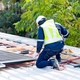 workers installing solar panels, for efficient energy on rooftop - PhotoDune Item for Sale