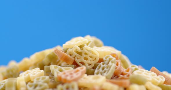 Different Colors of Dry Pasta Rotelle Rotates Slowly alt