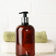 Soap bottle and towel stack on white bathroom background. - PhotoDune Item for Sale