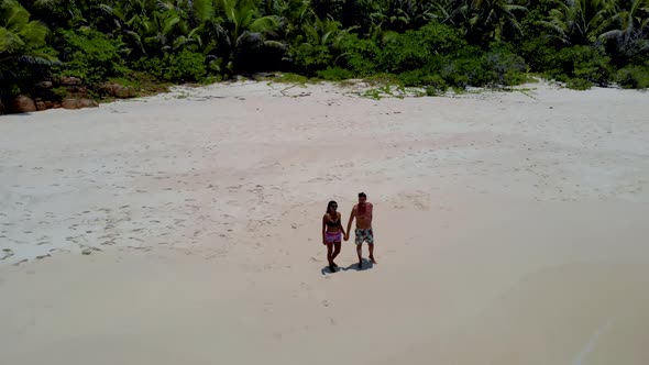 Coco Island La Digue Seychelles Young Couple Men and Woman on a Tropical Beach During a Luxury alt