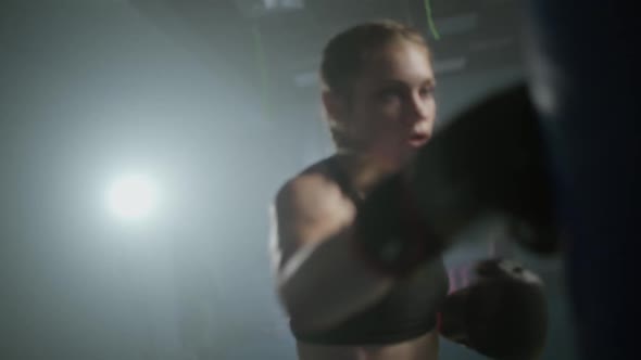 Female Fighter Trains His Punches Beats a Punching Bag Training Day in the Boxing Gym the Female alt