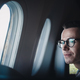 Passenger looking through airplane window - PhotoDune Item for Sale