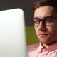 Closeup Face of Focused Business Man in Glasses Looking at Laptop Screen Working on Computer Sitting - VideoHive Item for Sale