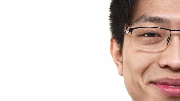 Half Side Portrait Closeup of Joyful Chinese Man 20s Wearing Eyeglasses Smiling with Perfect Teeth alt