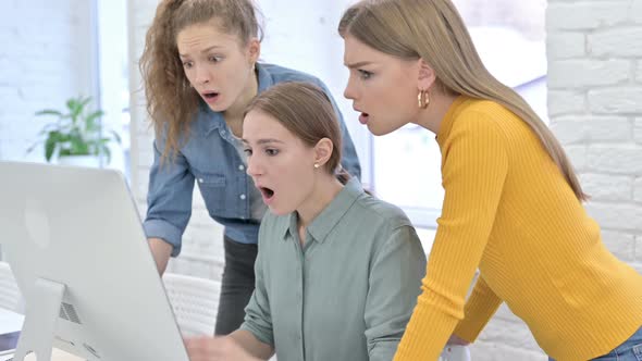 Disappointed Young Female Designers Reacting To Failure on Desktop alt