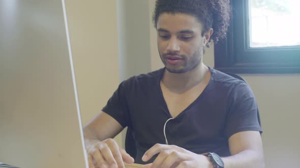 Young man using desktop computer
