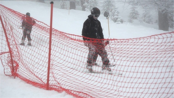 People Skiing In The Snow