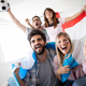 Diverse friends sports fans watching football match on TV at home. Celebrating shouting excited - PhotoDune Item for Sale